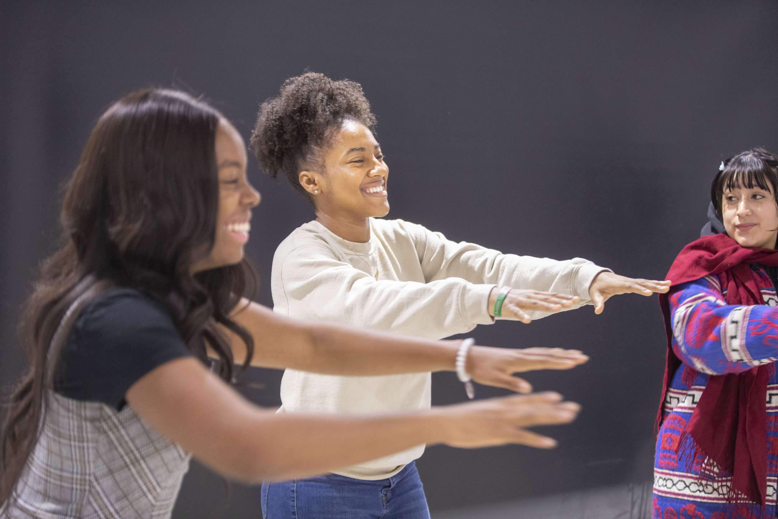 Erika Smith ’23, Shakira Hall ’23, and Claudia Carranza ’23 take part in an exercise.