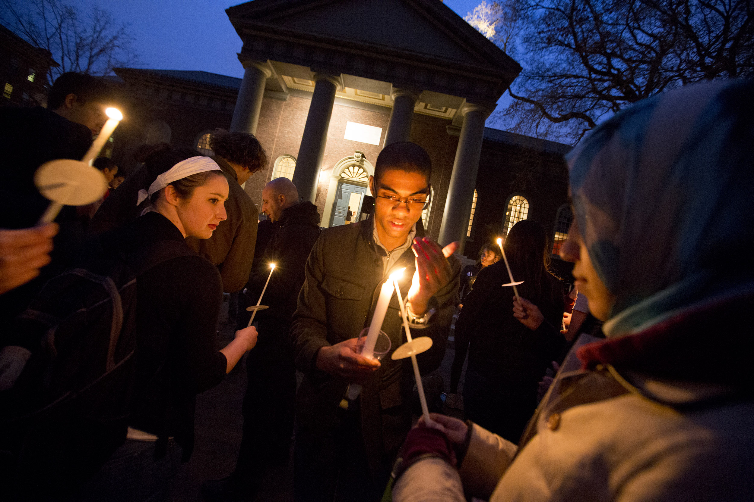 Students light candles.