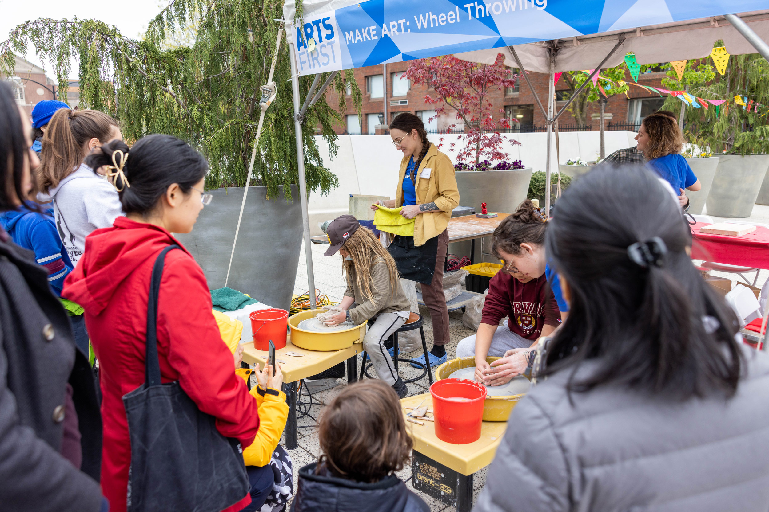 Children learn wheel throwing