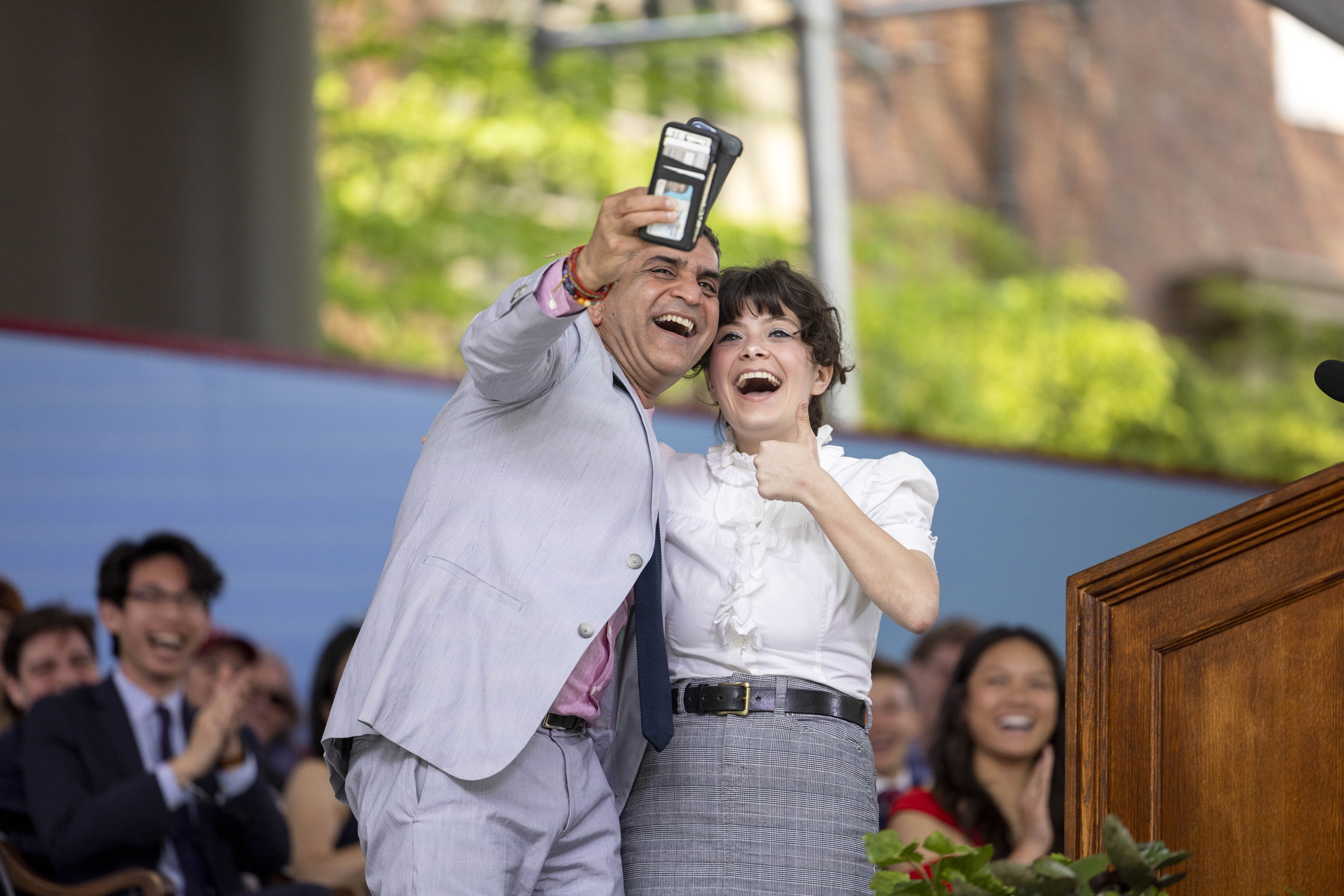 Rakesh Khurana holds camera to take selfie with Amelia Mary Cossentino.