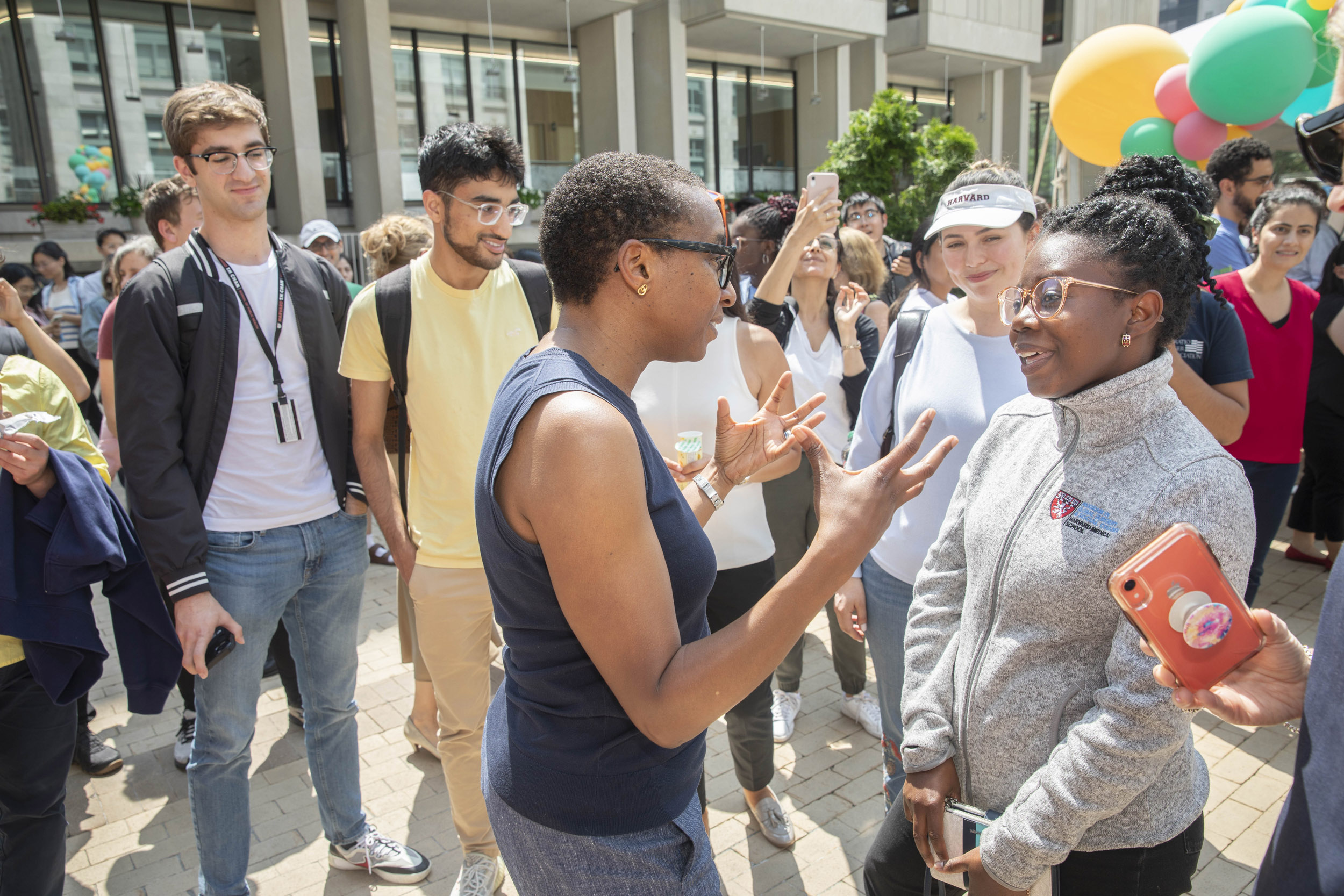 Harvard President Claudine Gay, (from left) and Tayana Jean Pierre, Harvard School of Public Health student.