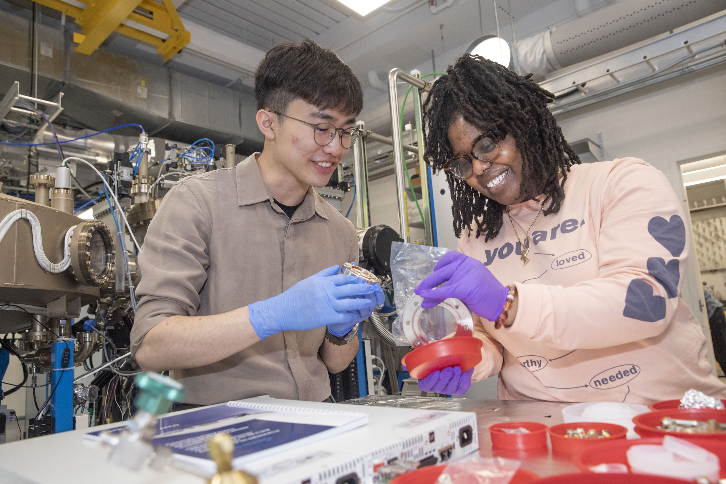 Kyeong Baek (left) and Nicole Taylor use Molecular beam epitaxy.