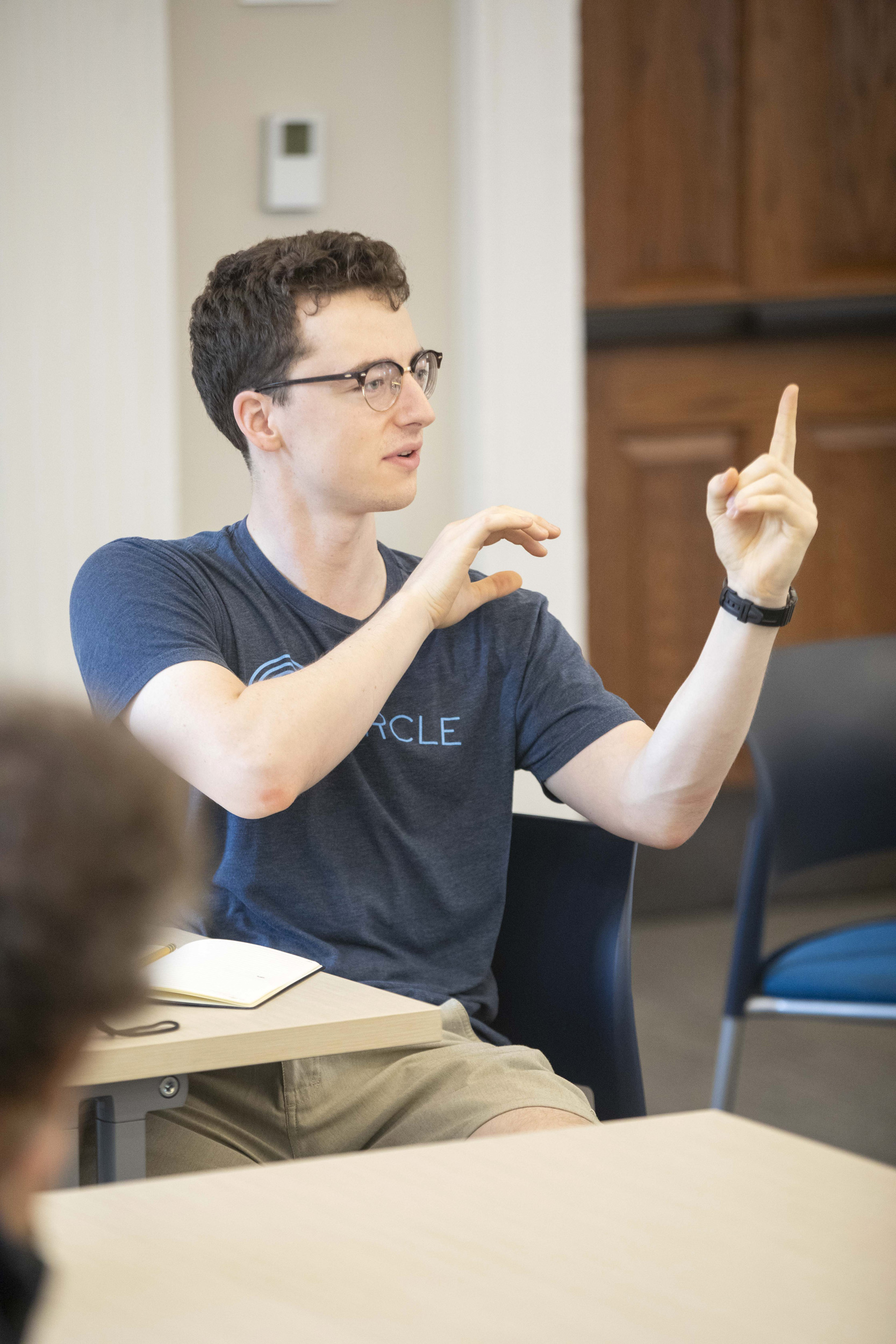 Mattheus Carpenter ’24 (left) directs a question at Naomi Oreskes, the Henry Charles Lea Professor of the History of Science and affiliated professor of Earth and Planetary Sciences.