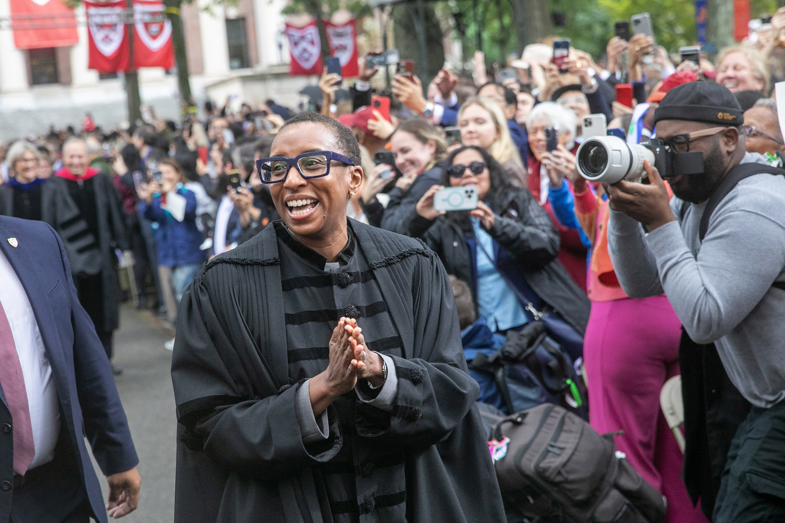 President Claudine Gay makes her way to the stage in Tercentenary Theatre.