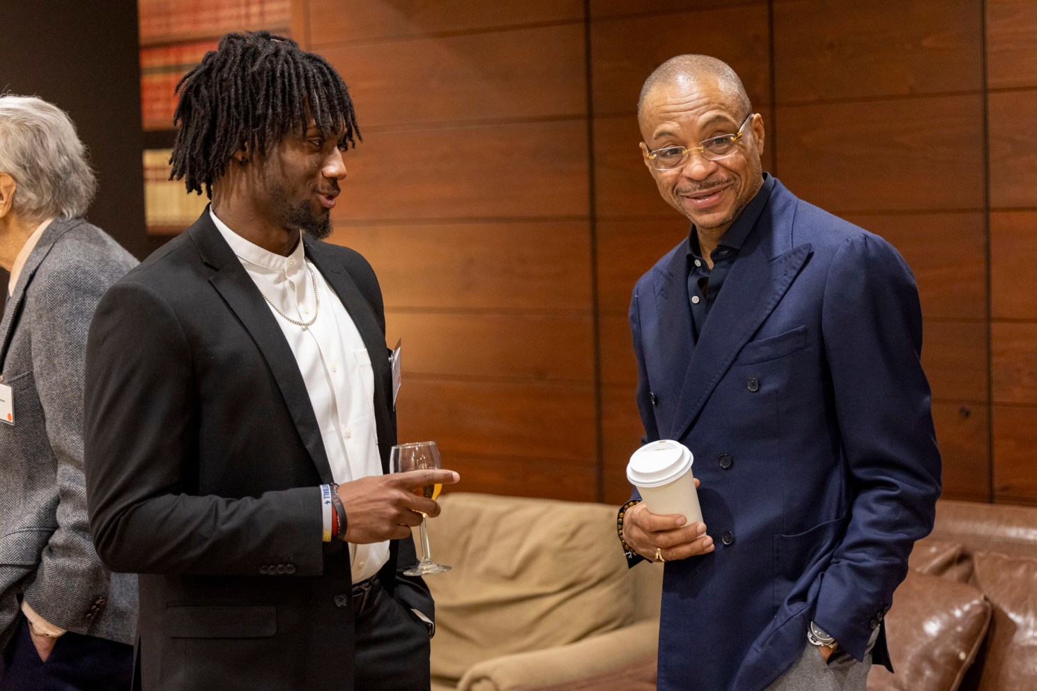 Kaleb Moody ’24 (left) talks with Gus Johnson.