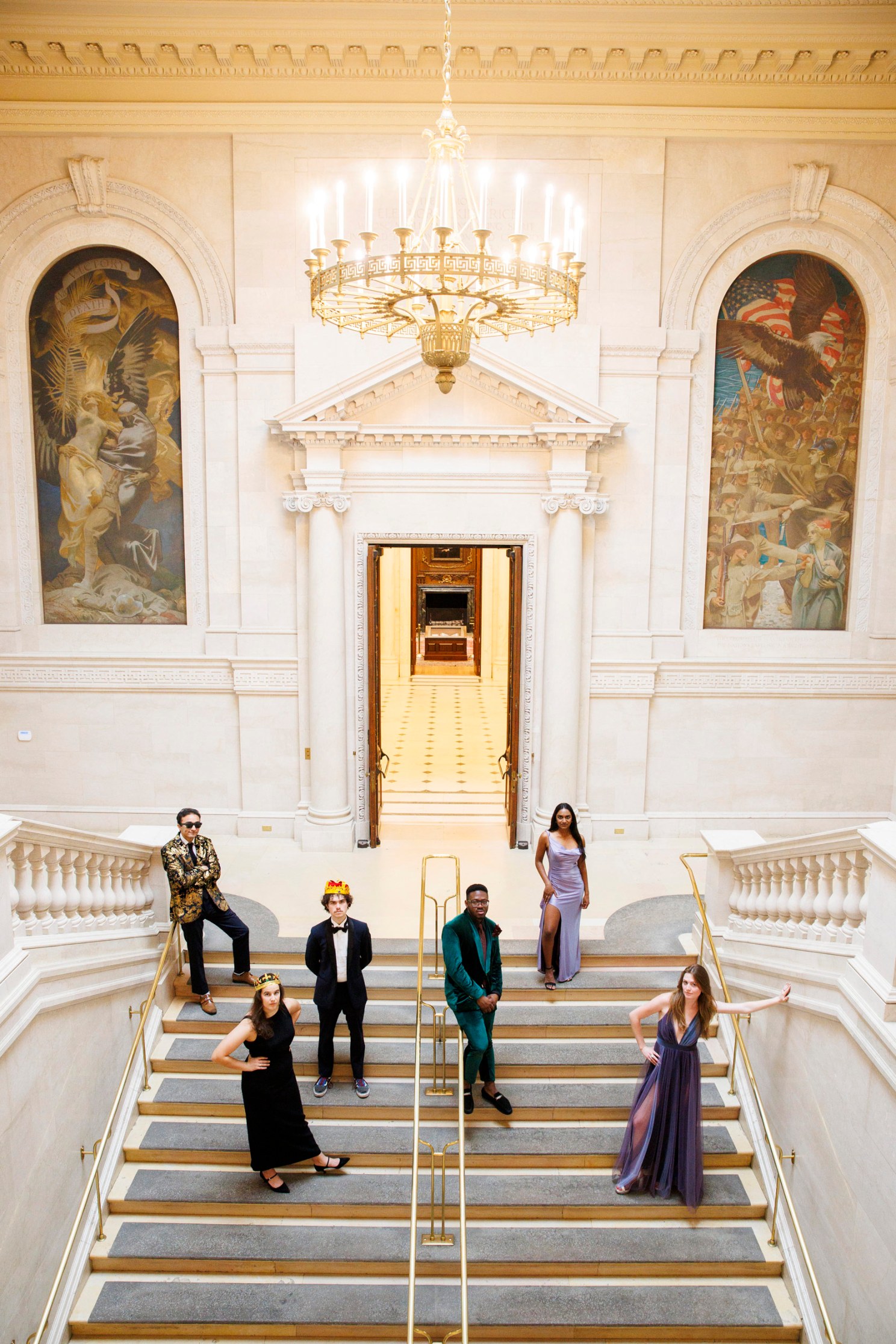 Harvard seniors gathered in their prom attire in Widener Library at Harvard University. 