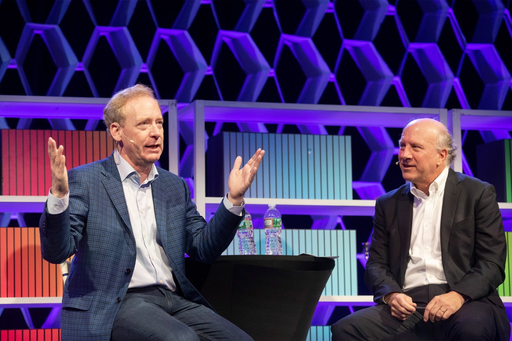 Harvard Business Review Editor-in-Chief, Adi Ignatius talks with Brad Smith (left), President and Chief Legal Officer, Microsoft