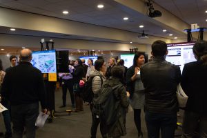 MPH students at Harvard T.H. Chan School of Public Health display and discuss their field work. Photos: Nilagia McCoy