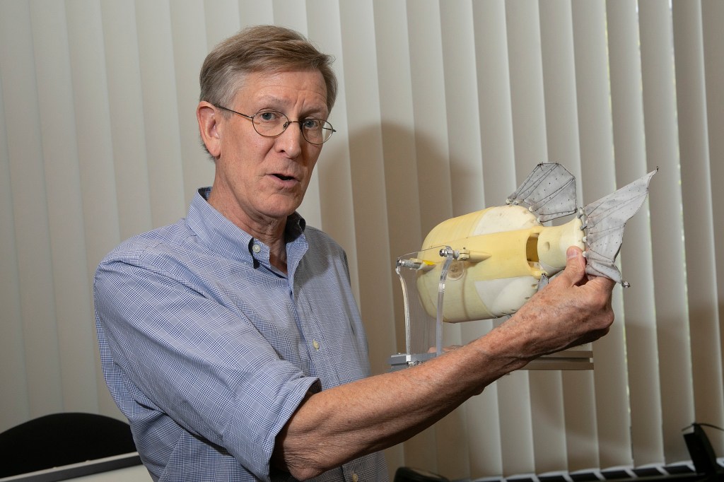 George Lauder holding a robotic fish