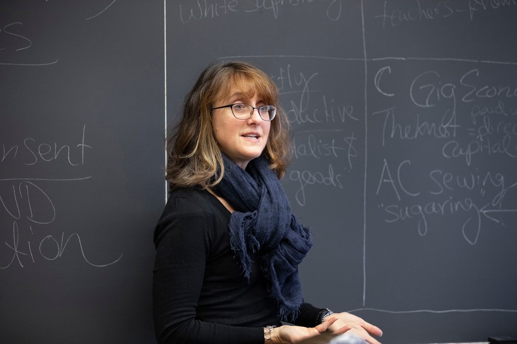 Caroline Light stands at the blackboard.