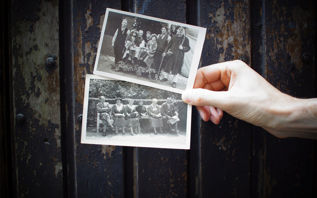 Hand holding old photographs