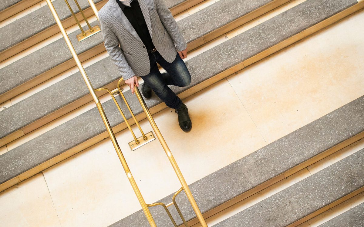 Mosab Abu Toha walking down the stairs.