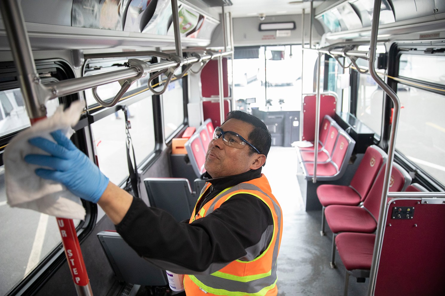 Cleaning a shuttle bus.