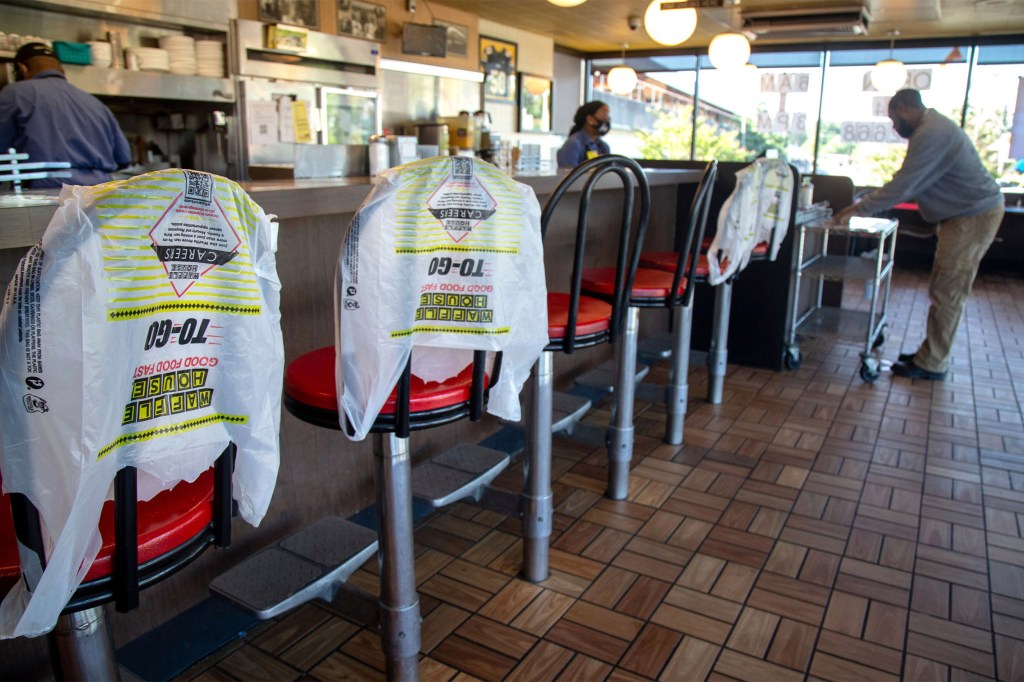 Customer picks up order in Waffle House.