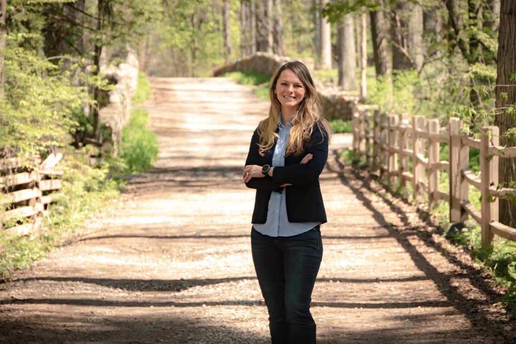 Kirstin Woody Scott on dirt road.