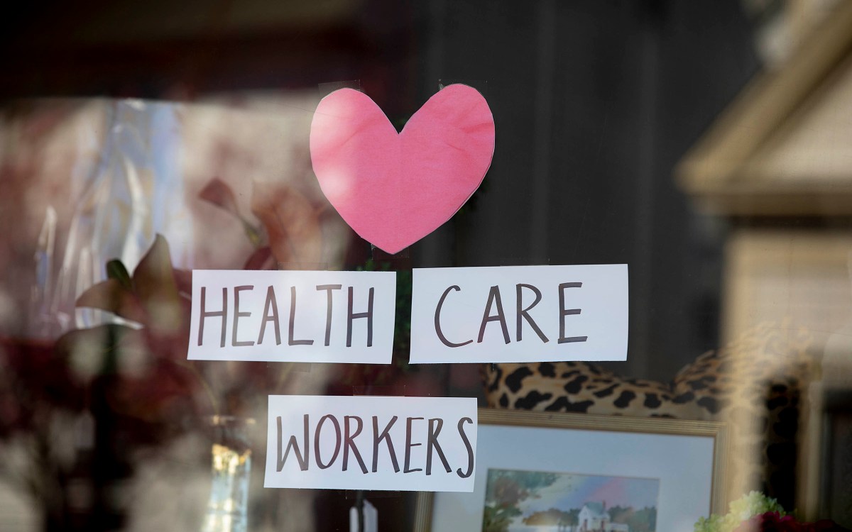 Thank you sign for health care workers in a window.