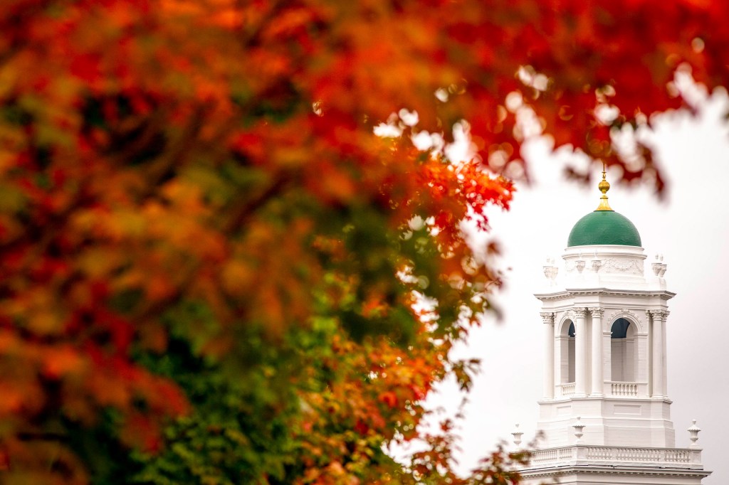 View of fall foliage and Eliot House.