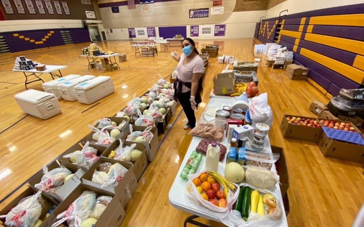 Shandiin Herrera assembles food boxes.