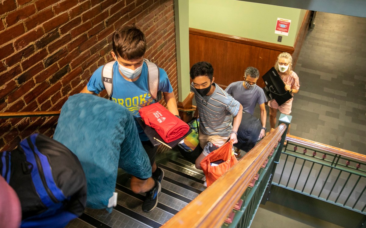 Keegan Harkavy '25 leads the way up the stairs with his parents Brad and Mador Harklavy taking up the rear.