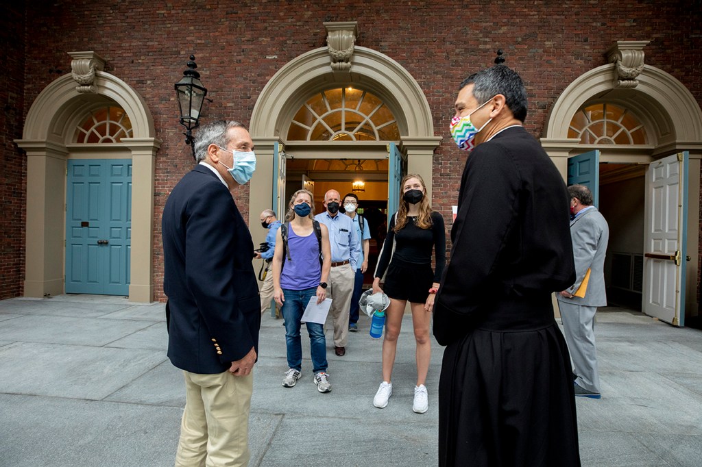 Larry Bacow and the Reverend Matthew Potts,