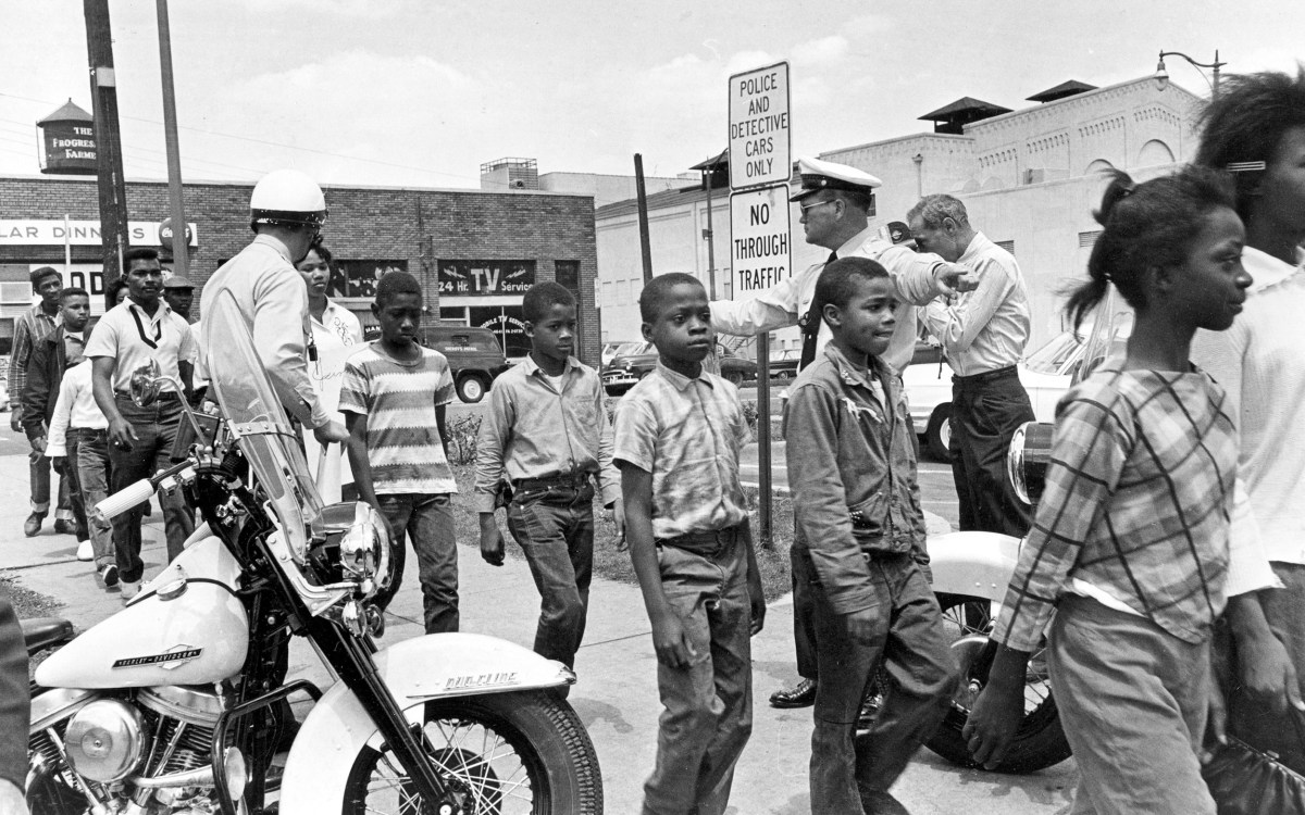 A 1963 photo of police leading a group of Black children to jail.