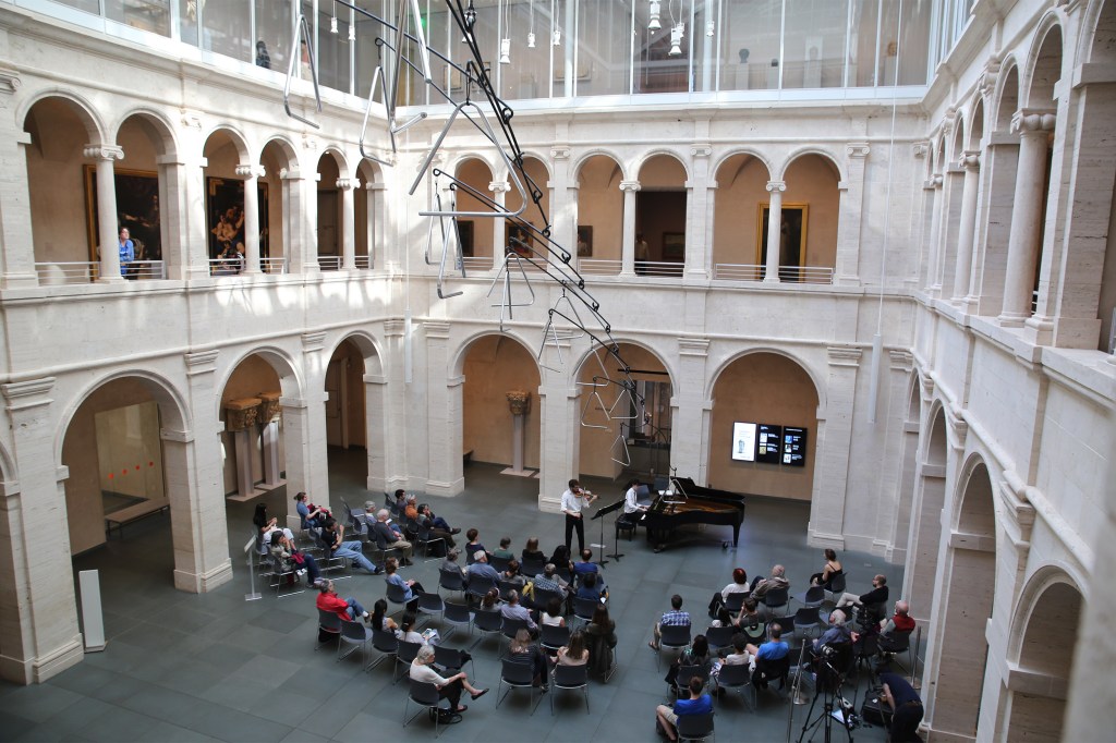 Student orchestra in Calderwood Courtyard, Harvard Art Museums.