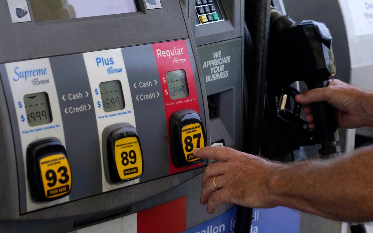 Motorist pumps gas.