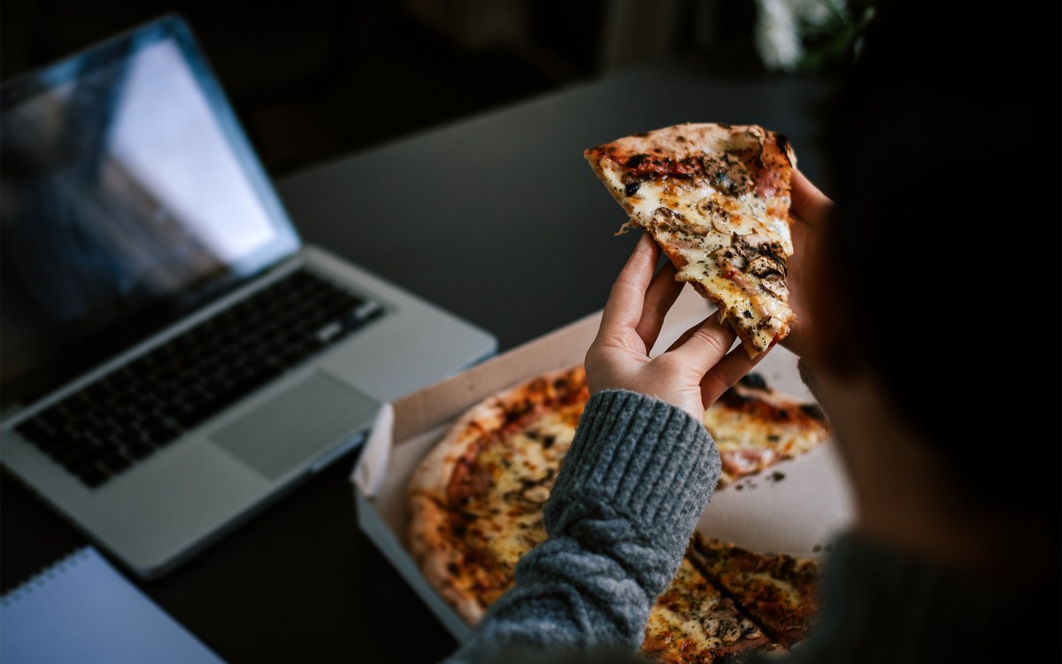 Eating pizza late at night.