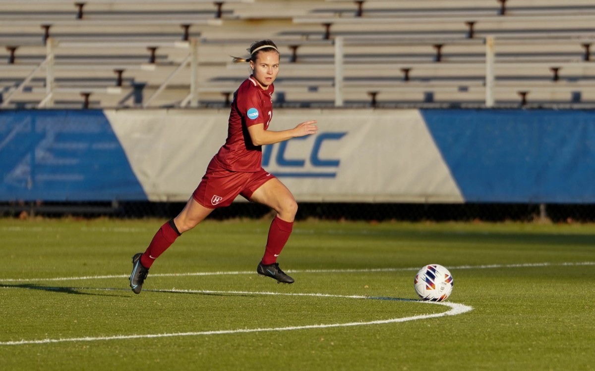 Josefine Hasbo runs on field.