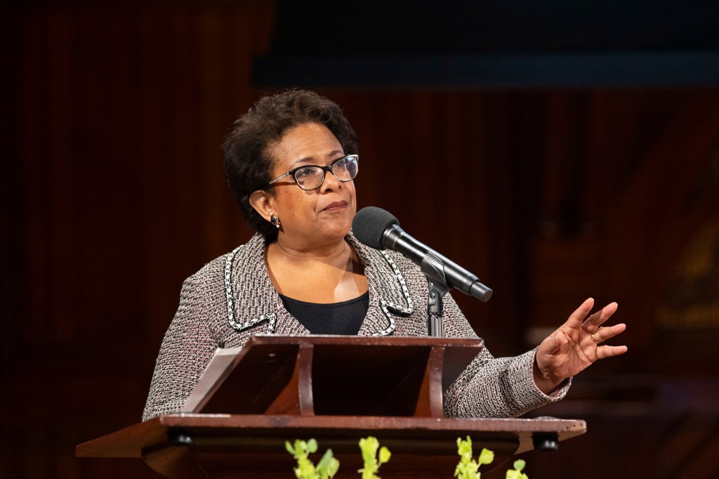 Loretta E. Lynch at lectern.