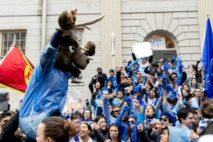 Lowell House students cheer for their house on the steps of University Hall.