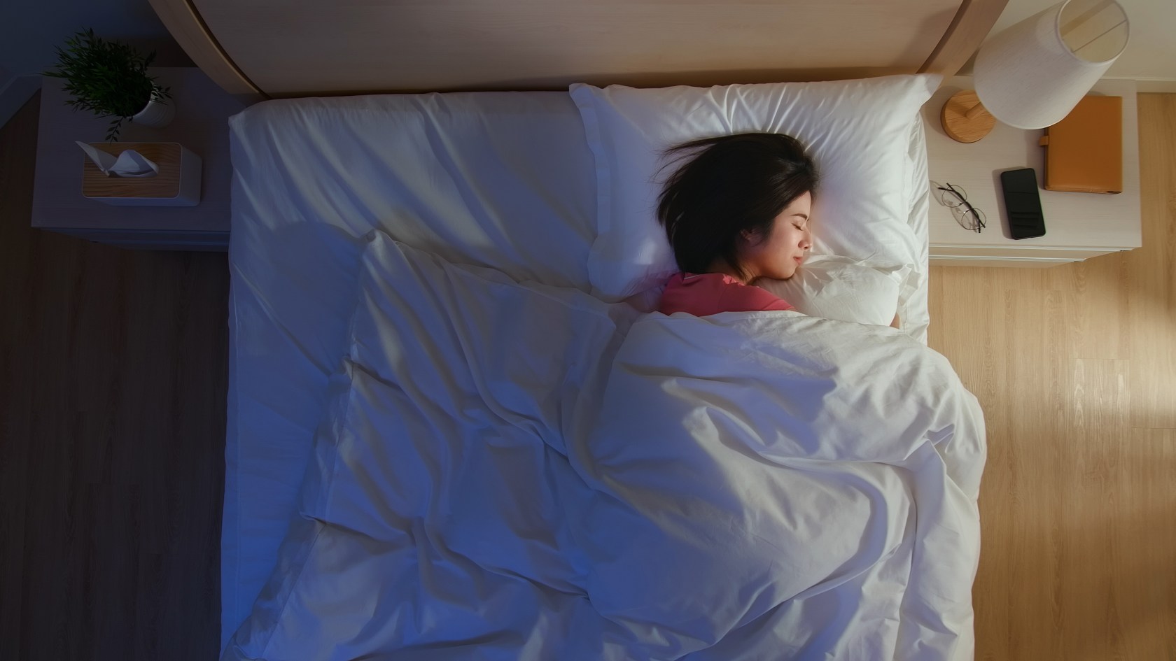 Woman sleeping in bed.