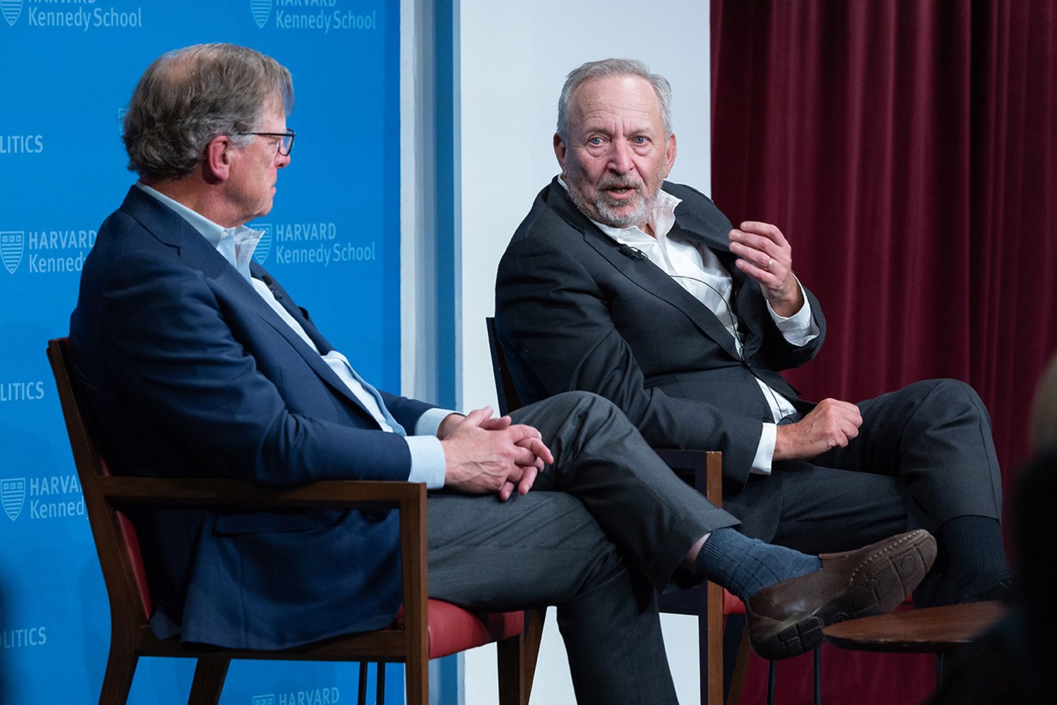 Journalist John Ellis and Lawrence Summers.