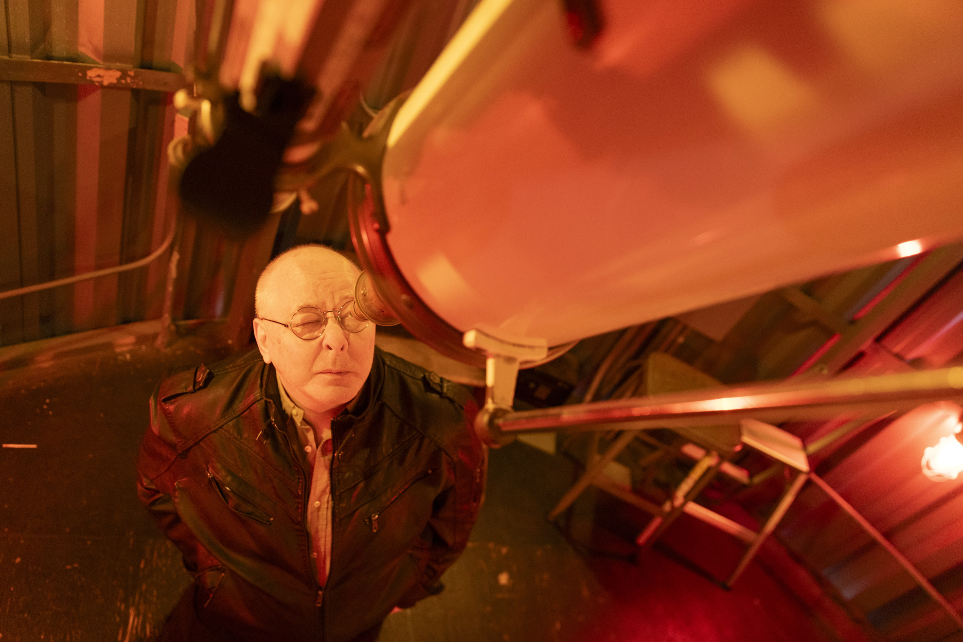 John Buonomo, Senior Cloud Architect and astrophotographer, looking through one of the telescopes at the Harvard Center for Astrophysics.