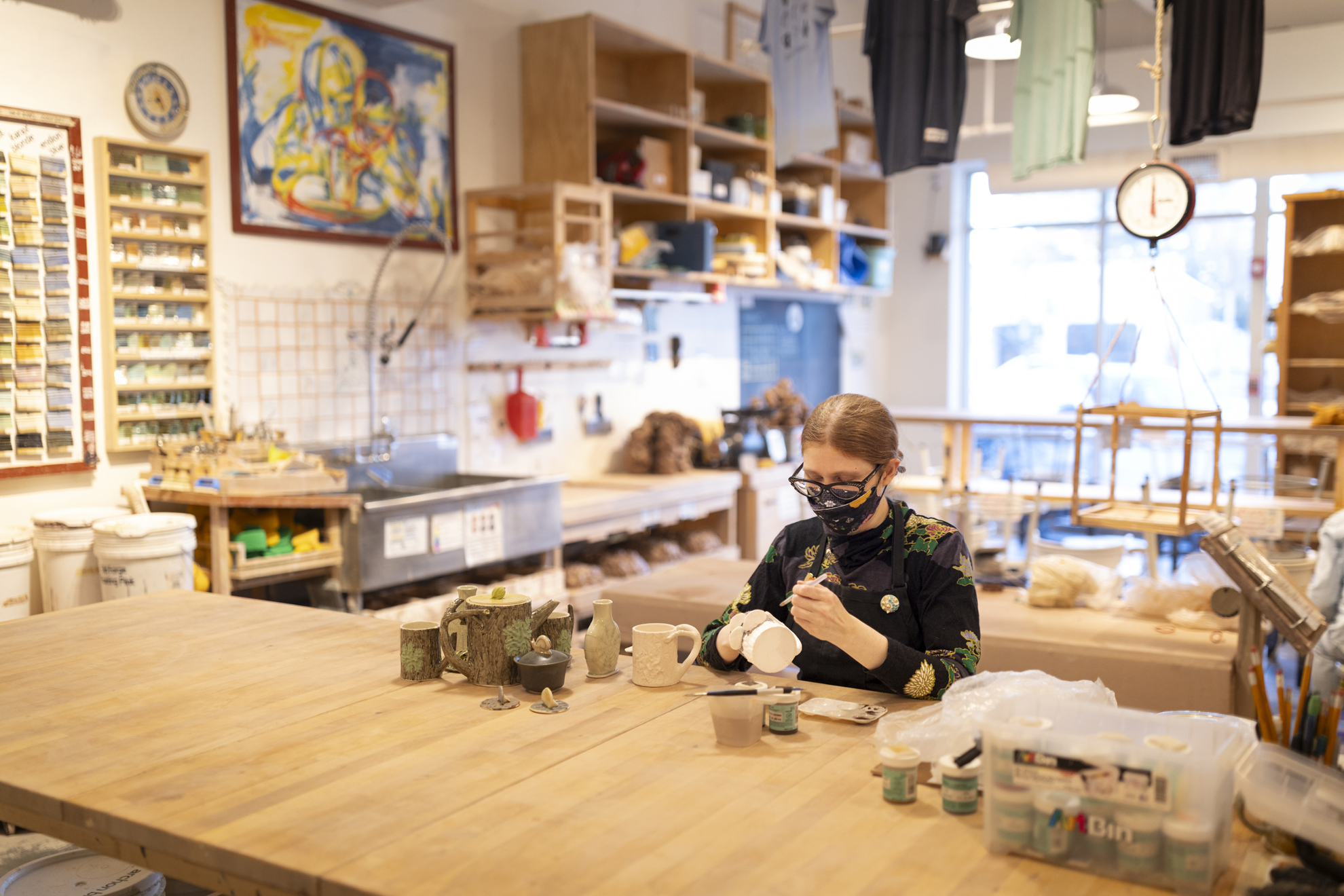 Fionnuala Gerrity, Conservation Technician at Harvard Library Preservation Services and ceramicist, working on a piece of ceramics at Indigo Fire Pottery Studio in Belmont, MA. 