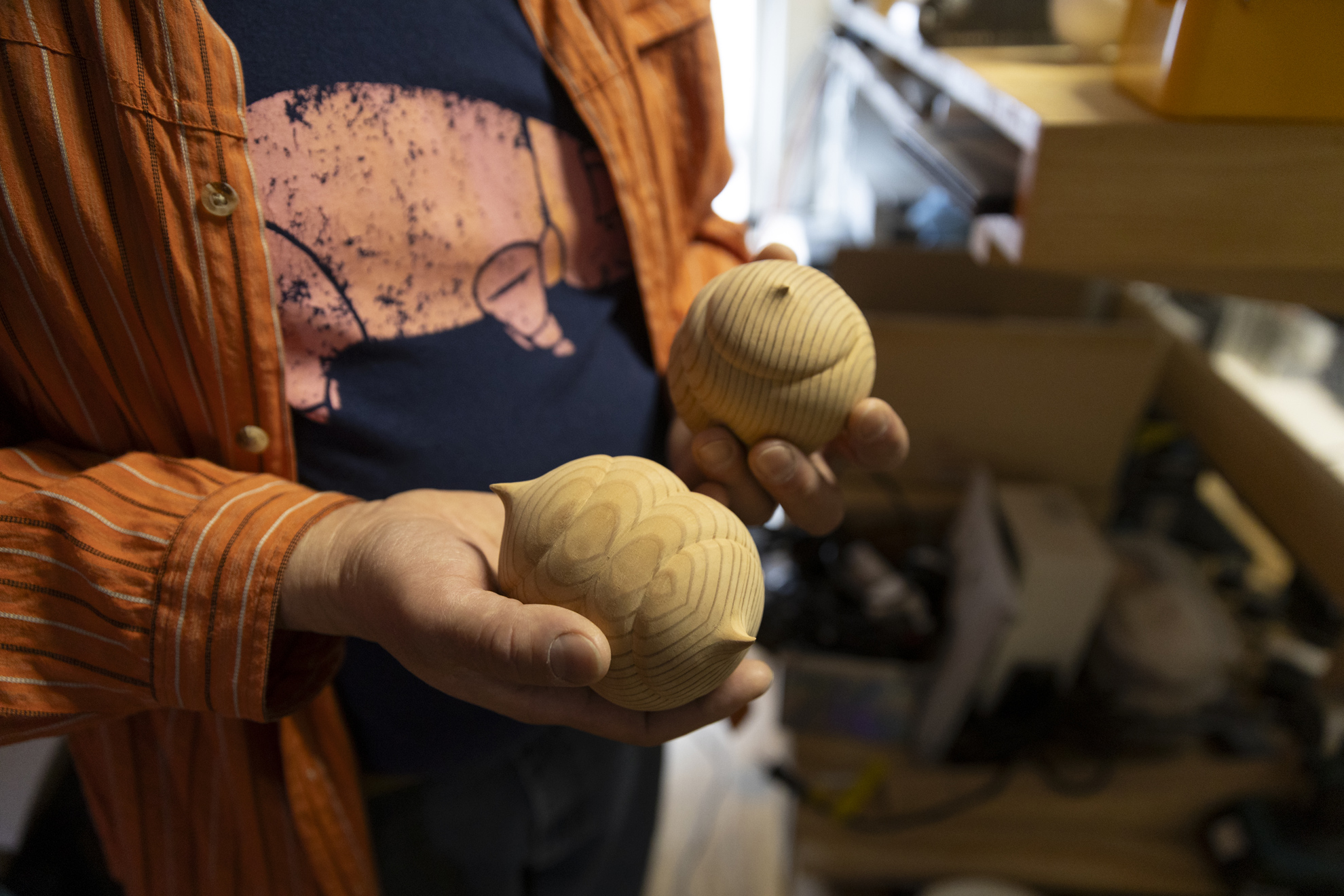 Toru Nakanishi, Exhibition Production Specialist at the Harvard Art Museums, photographer, and sculptor showing two of his sculptures in his apartment in Somerville, MA.