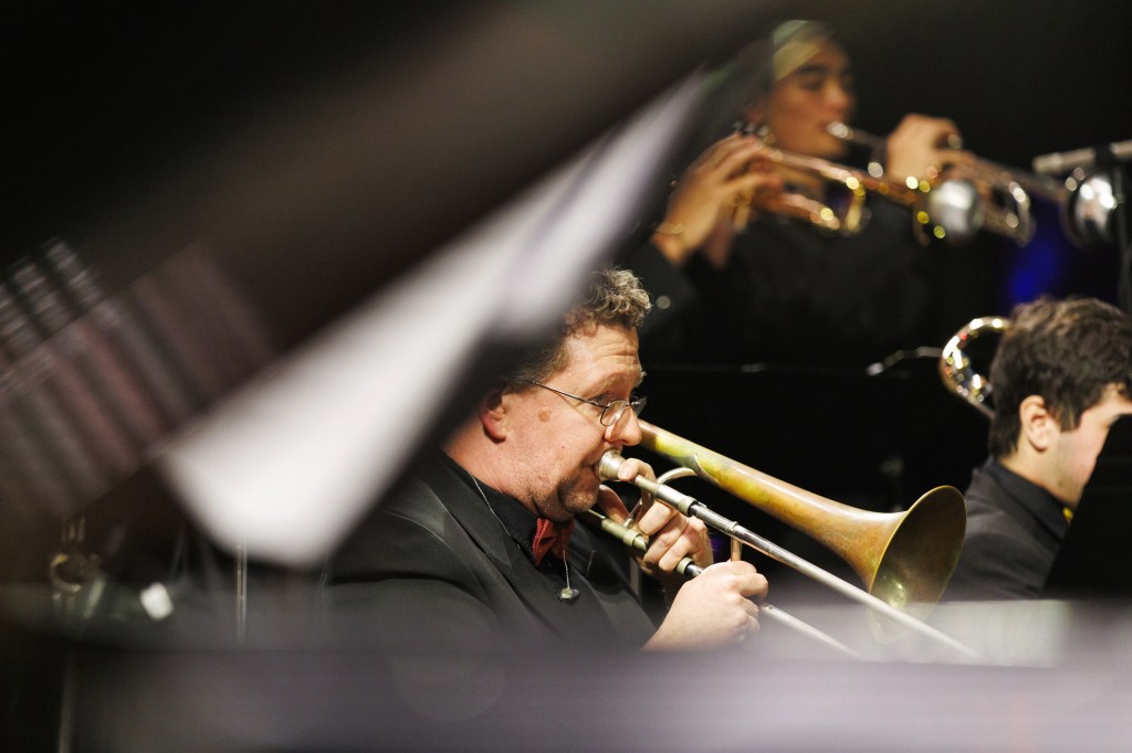 Ed Hutton Ph.D, HMS, (pictured) performs trombone during the concert.
