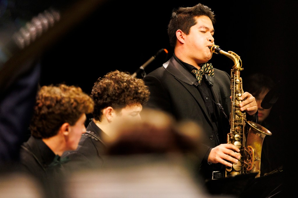 Matthew Chen '26 (right) performs on saxophone during the concert.