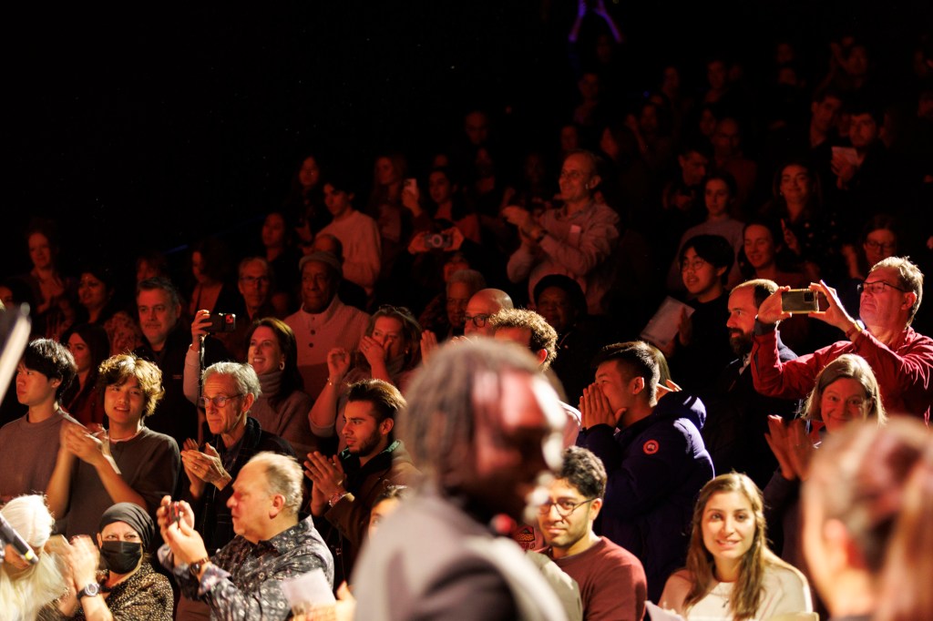 The audience gives a standing ovation following the performance.