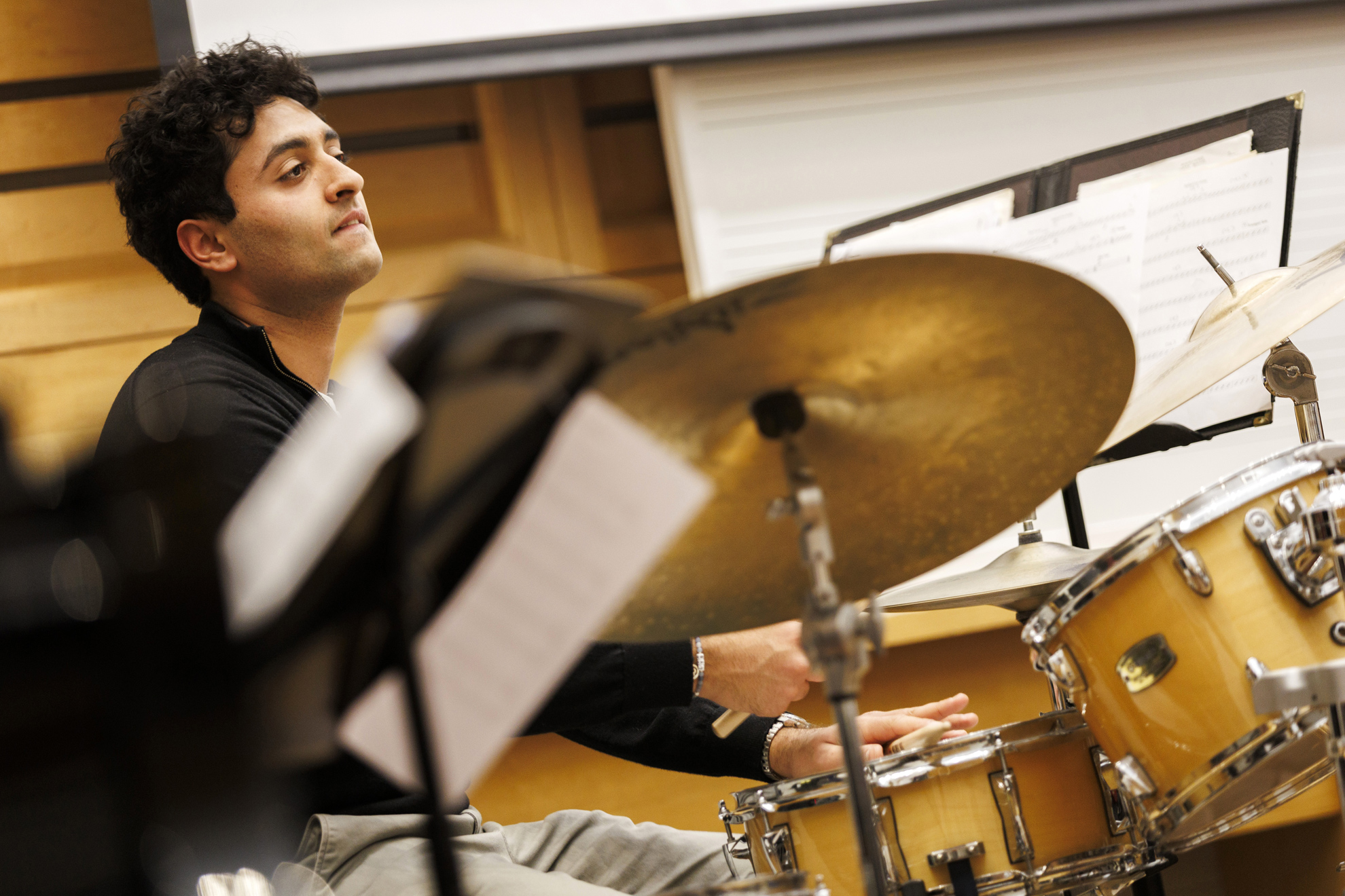 Raghav Mehrotra ’26 plays drums during rehearsal. 