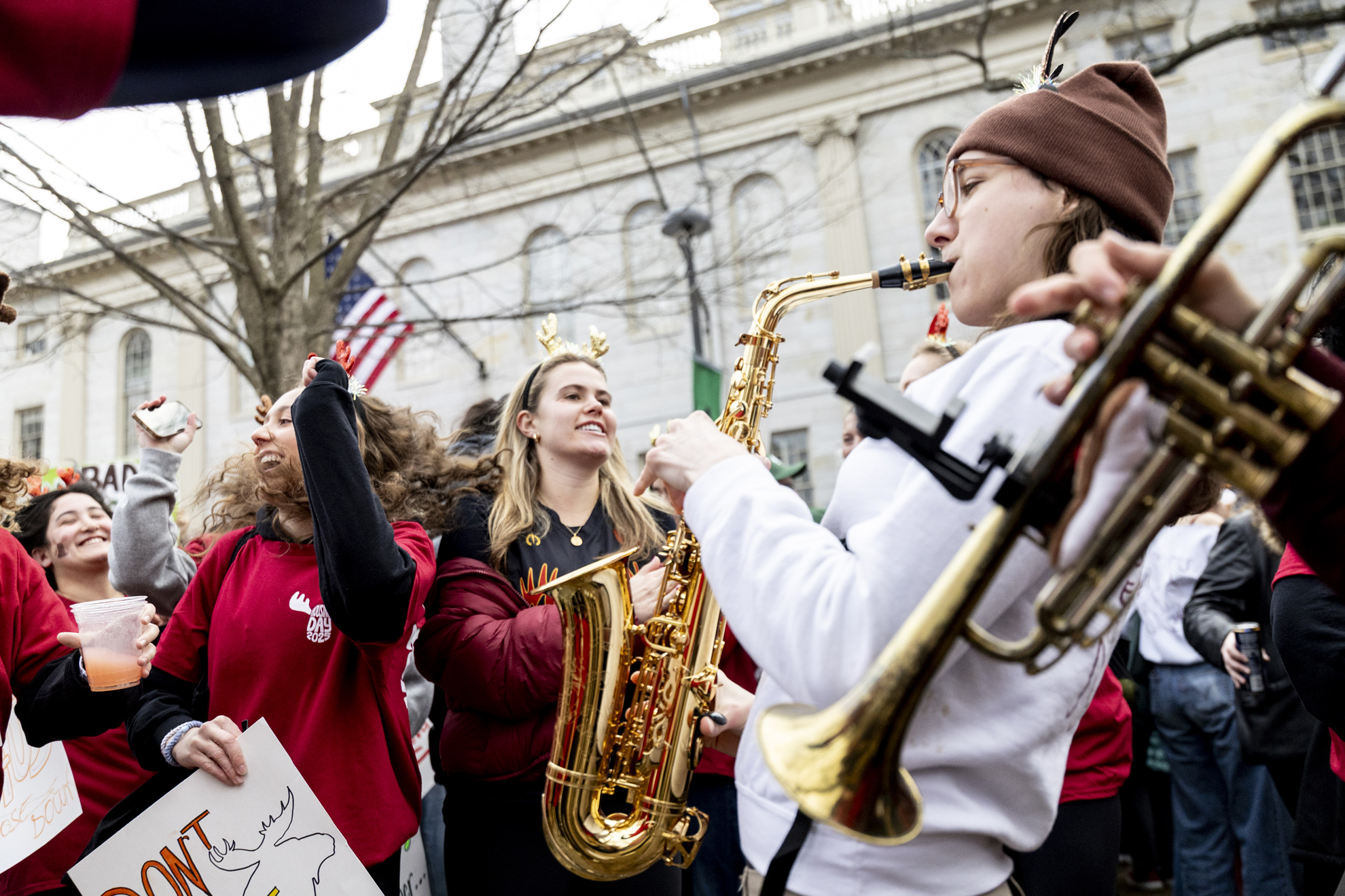 Dunster House residents play music and dance in Harvard Yard before storming first-year dorms.