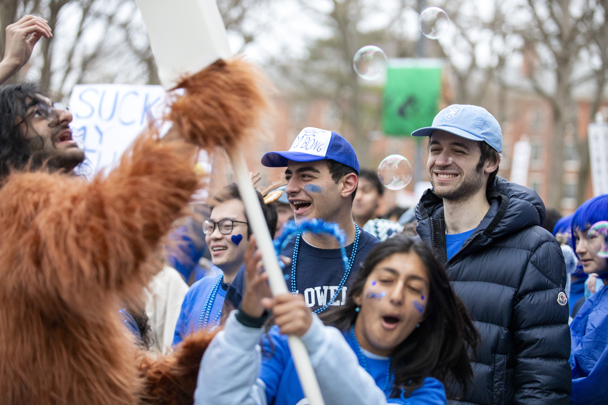 Lowell and Eliot house residents rally in front of University Hall.