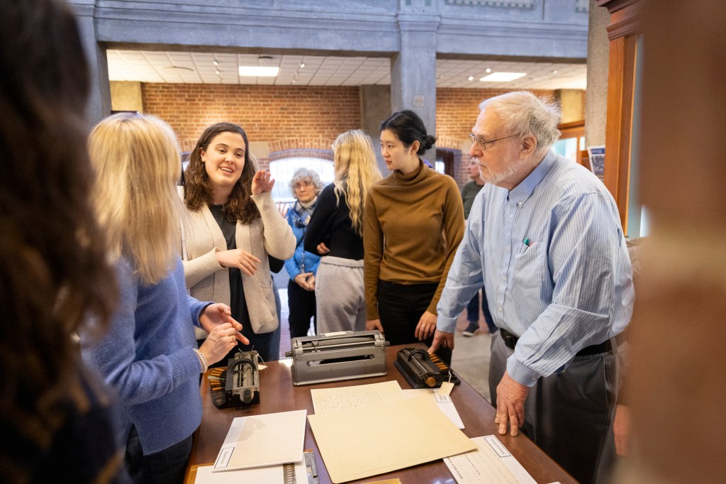 Katie Sevier '25 (left) and Marc Shell (far right) in conversation during the trip.