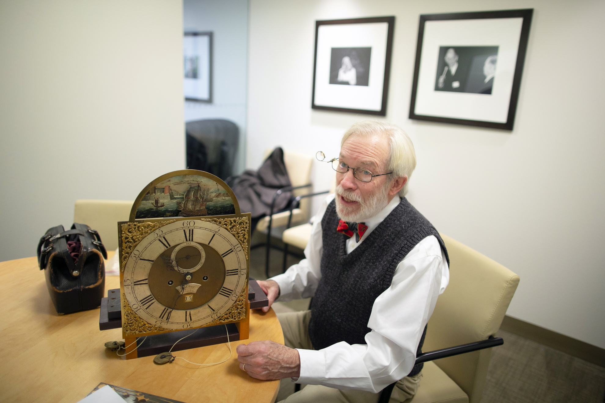 Richard Ketchen, who tends to and maintains Harvard's clocks, is pictured working on a clock at the Graduate School of Arts and Sciences.