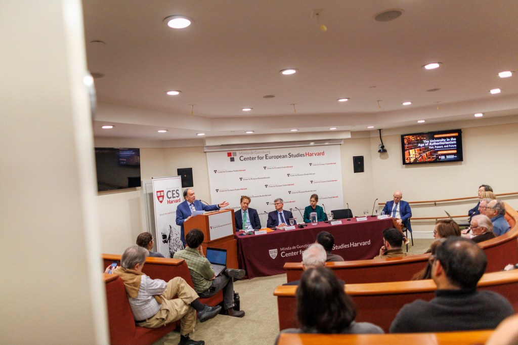 The panel seated at a table.