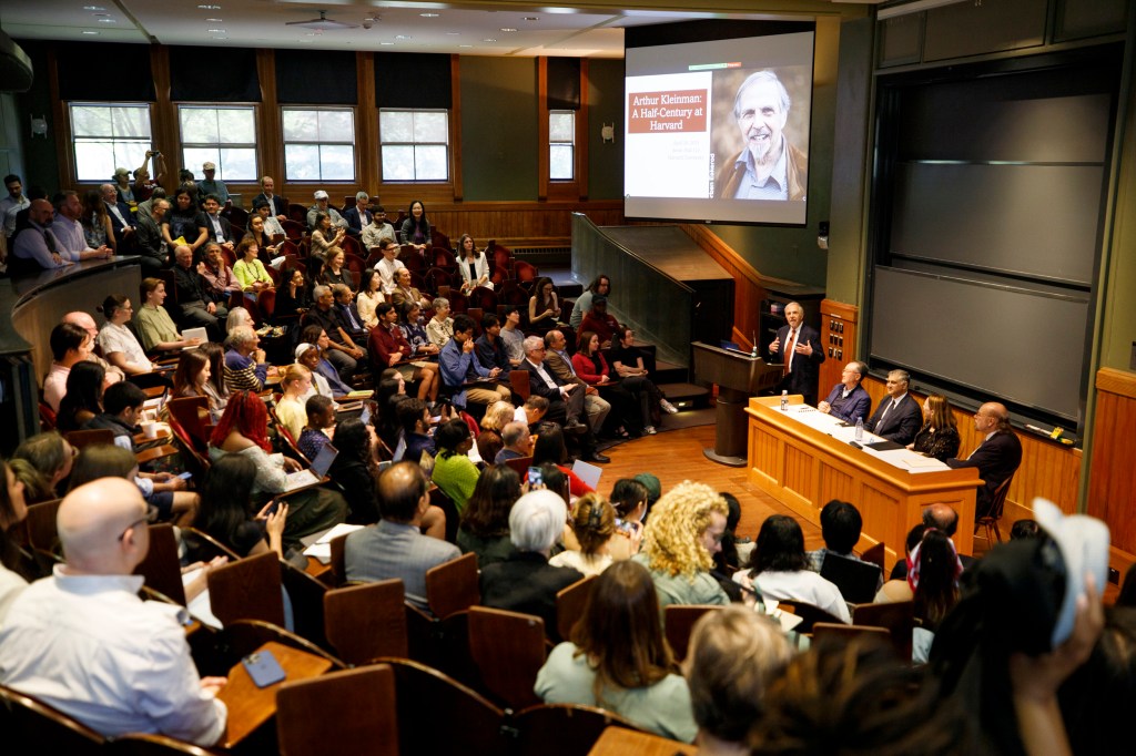 The meeting drew nearly 200 current and former students to Sever Hall.