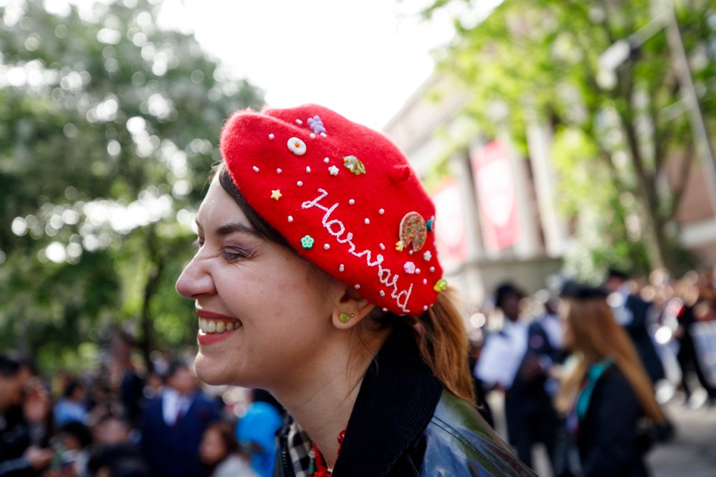 Alexandra Nebel wears a hand embroidered hat to celebrate the 374th Harvard University Commencement Exercises.