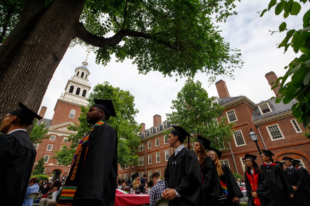 Graduates wait to receive their diplomas at the Lowell House.