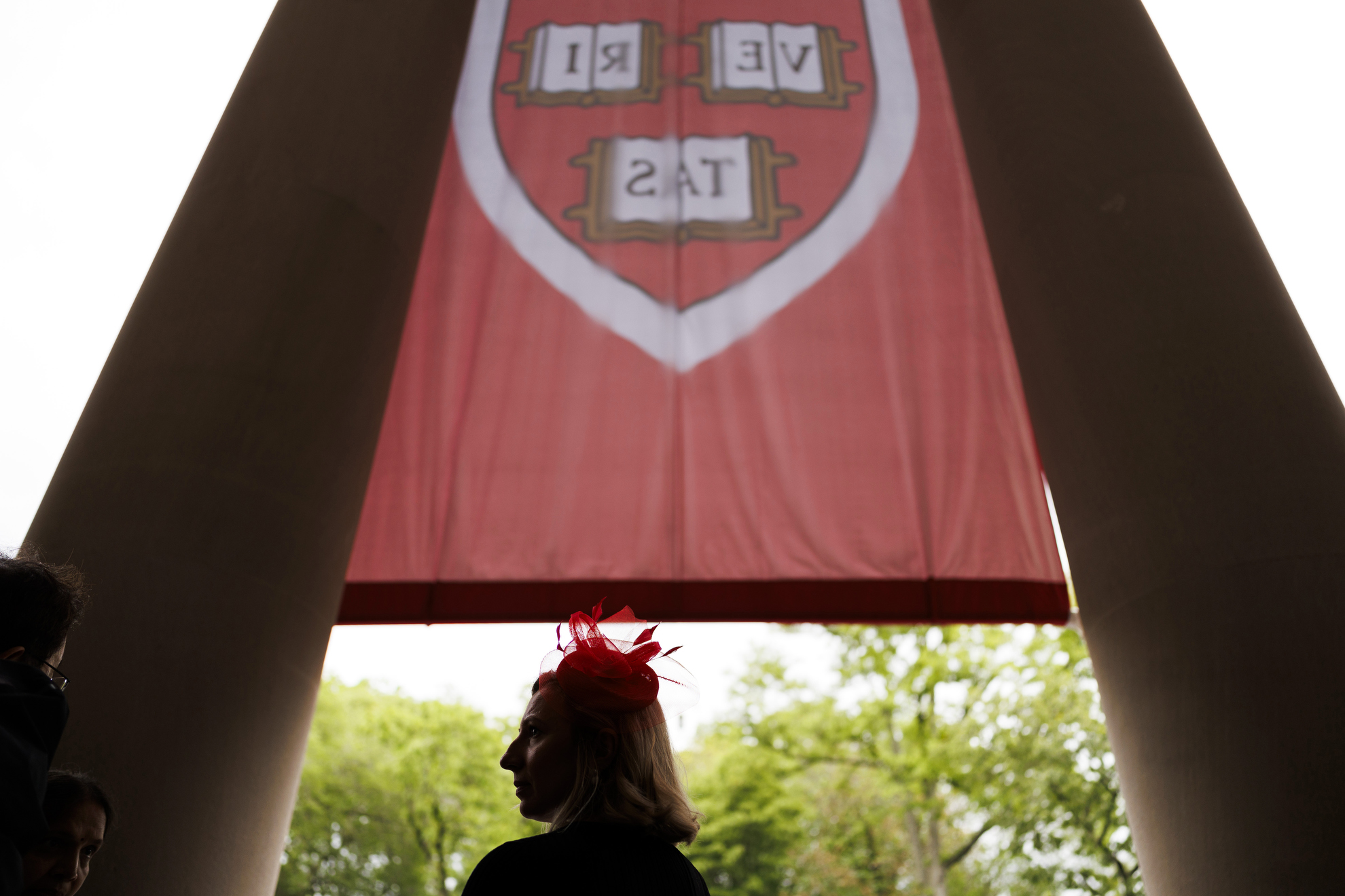 A staff member watches the ceremony.