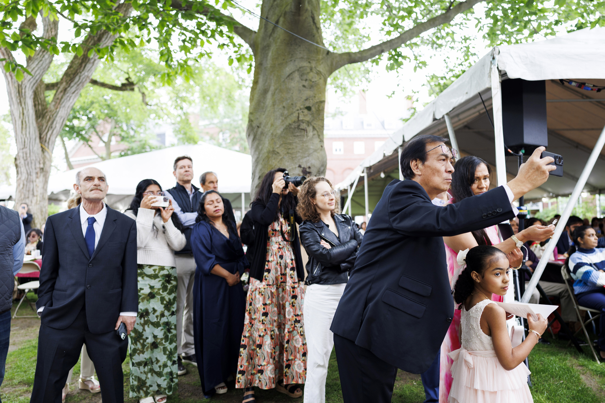 Family members watch the ceremony.
